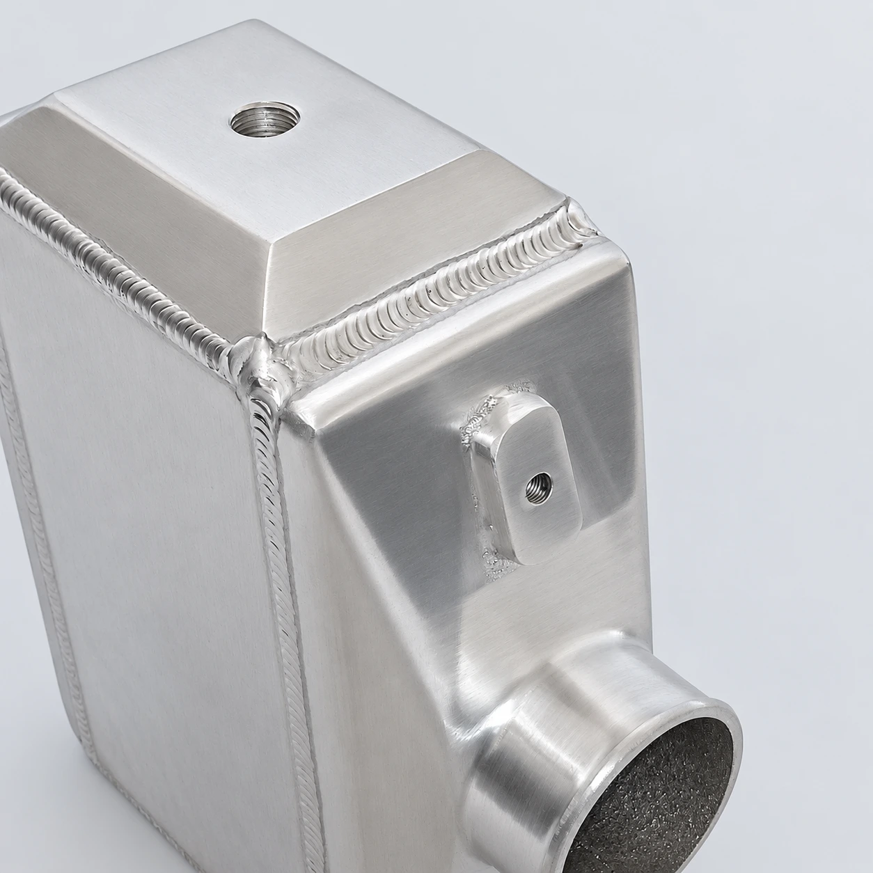 AWIC003-C close-up · Threaded port, mounting boss and welds