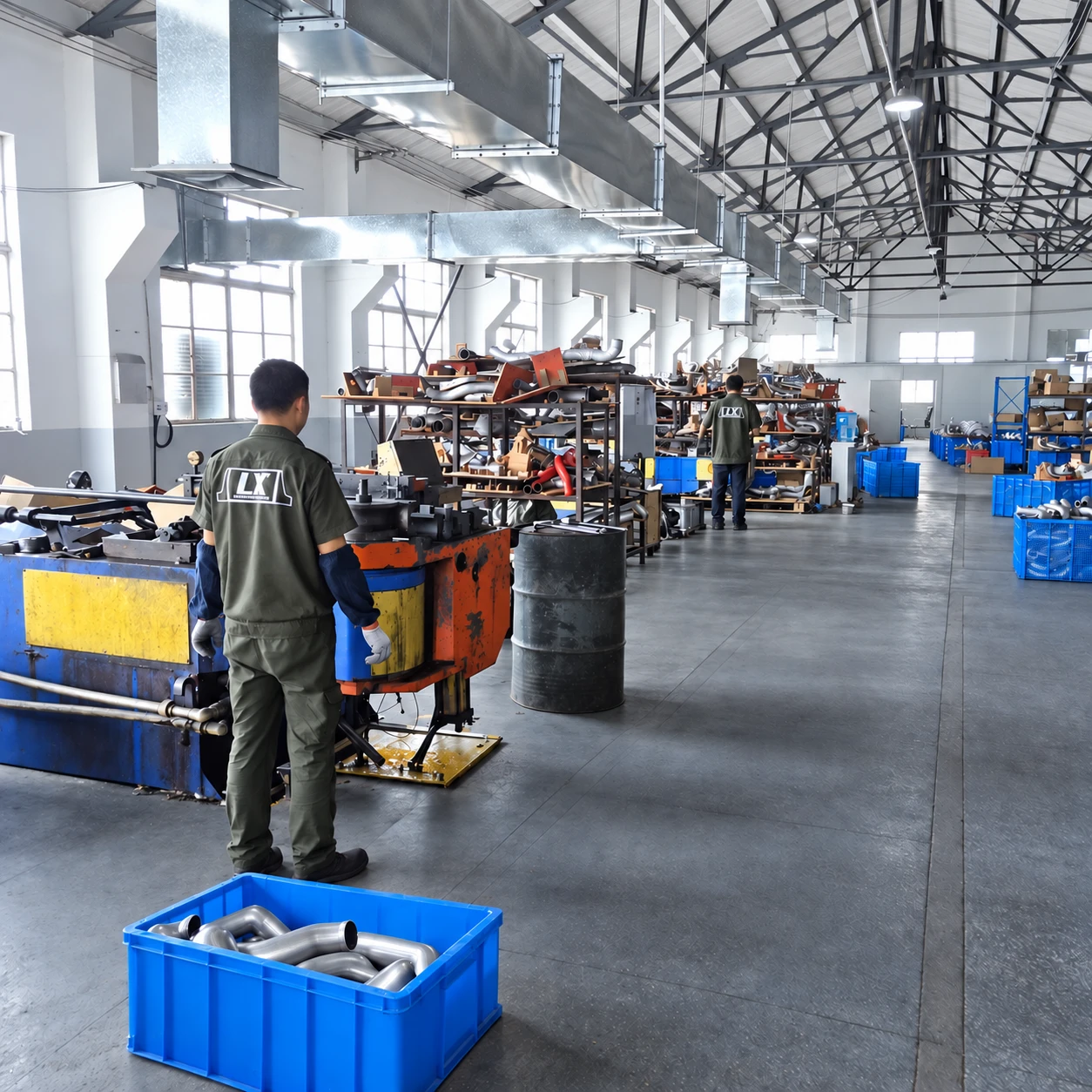 Aluminum pipe bending equipment and operators in the workshop.