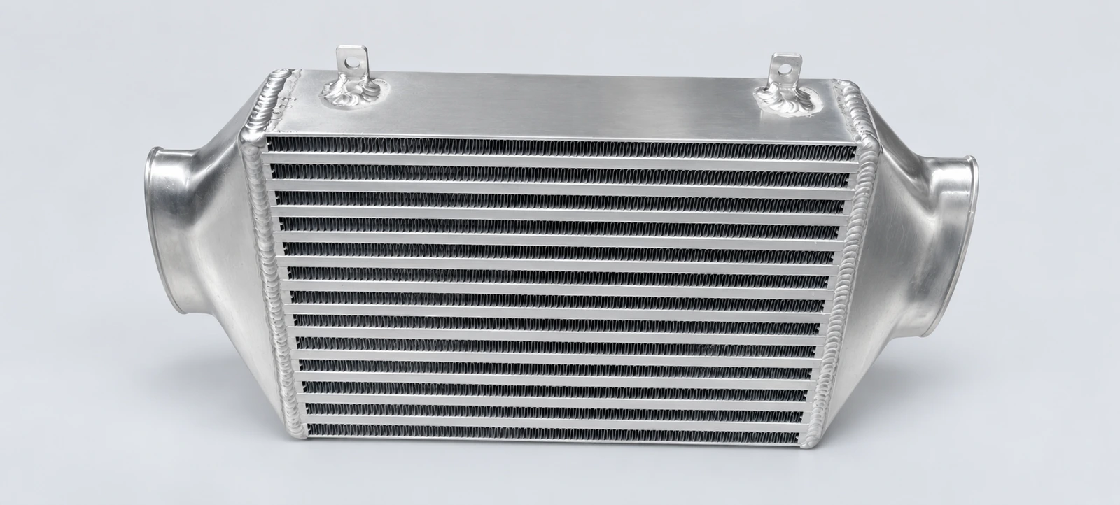 Mini Cooper S R53 Intercooler: Angled view · End tanks and mounting tabs